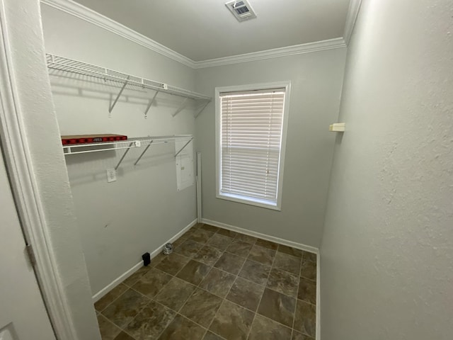 clothes washing area with laundry area, ornamental molding, visible vents, and baseboards