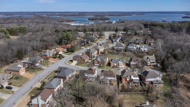 drone / aerial view with a water view and a residential view