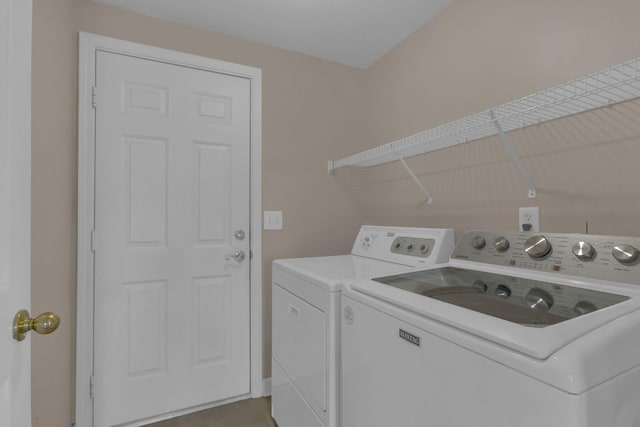 clothes washing area featuring laundry area and washer and dryer