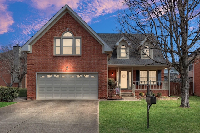 traditional-style home featuring concrete driveway, brick siding, a lawn, and a porch