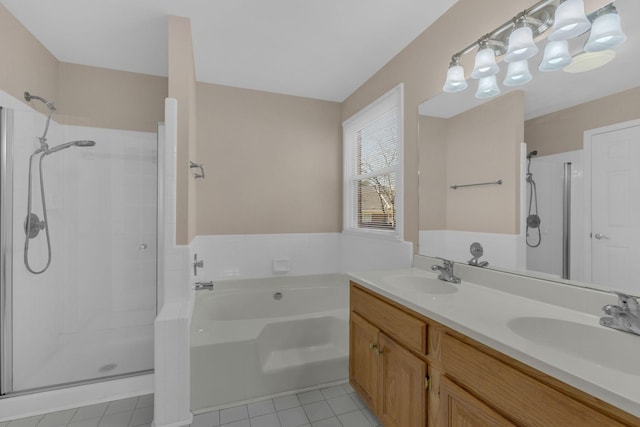 bathroom featuring a stall shower, a sink, and a bath