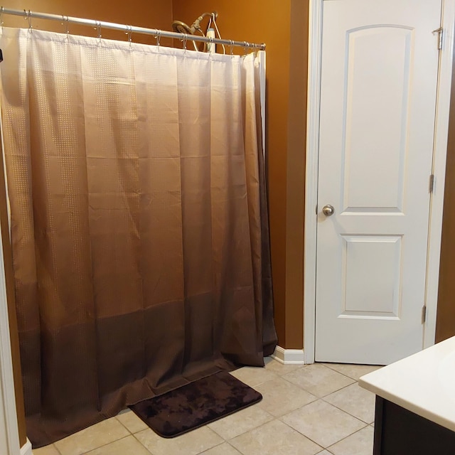 bathroom with vanity, a shower with shower curtain, and tile patterned floors