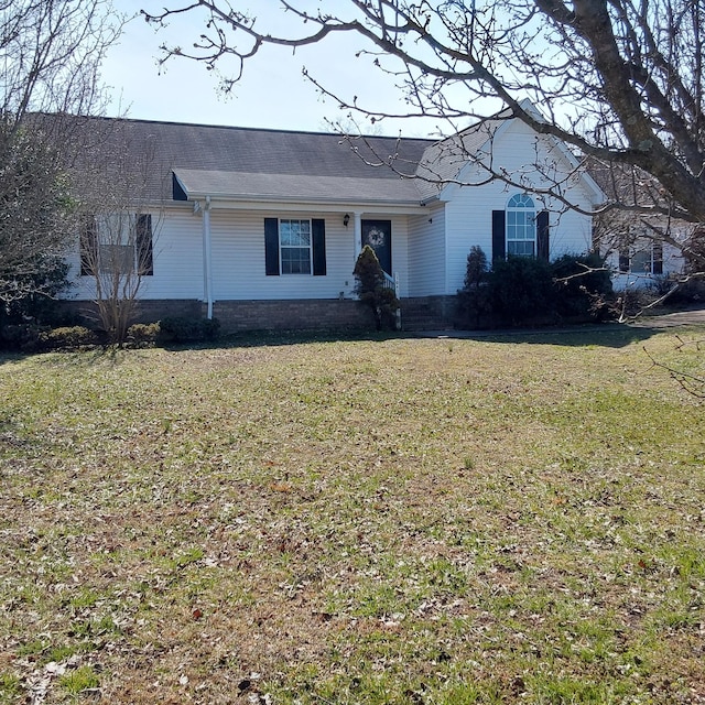 ranch-style home featuring a front yard