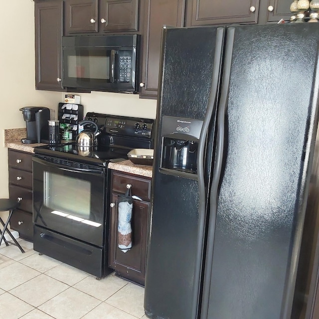 kitchen with light tile patterned floors, black appliances, dark brown cabinets, and light countertops