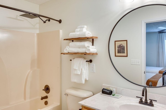 bathroom with toilet, vanity, and shower / tub combination