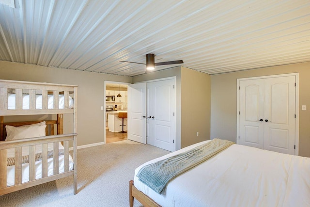 bedroom with a closet, carpet flooring, a ceiling fan, and baseboards