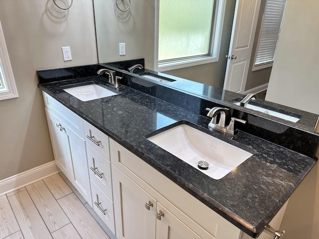 bathroom featuring a sink and wood finished floors