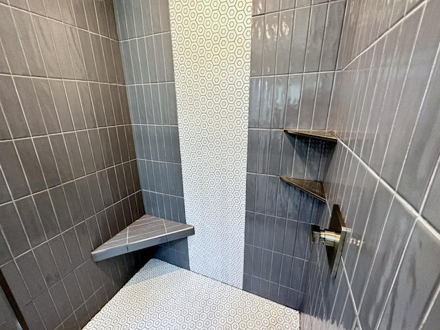 full bath featuring a tile shower