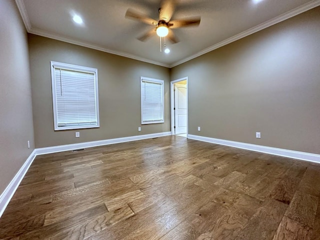 spare room with a ceiling fan, dark wood-type flooring, and baseboards