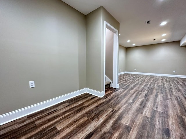 basement with dark wood finished floors, recessed lighting, visible vents, baseboards, and stairs