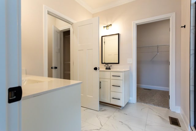 bathroom with visible vents, vanity, marble finish floor, ornamental molding, and a spacious closet