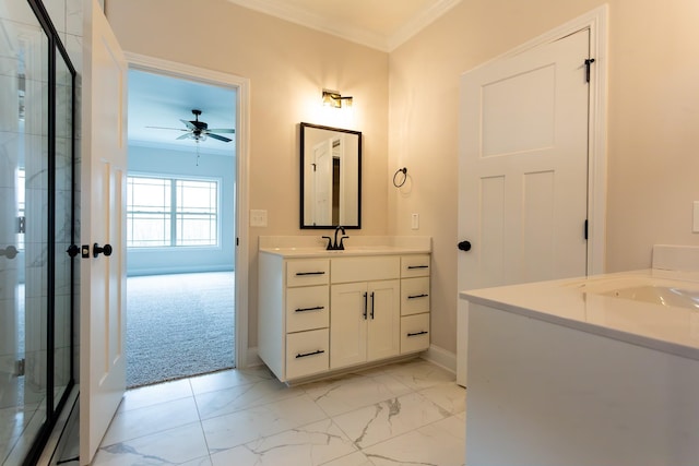 bathroom featuring a stall shower, marble finish floor, crown molding, and vanity