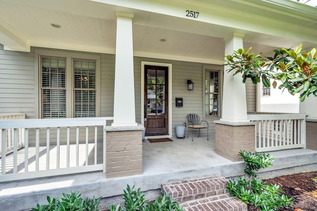 doorway to property with covered porch