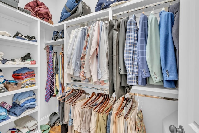 spacious closet with wood finished floors