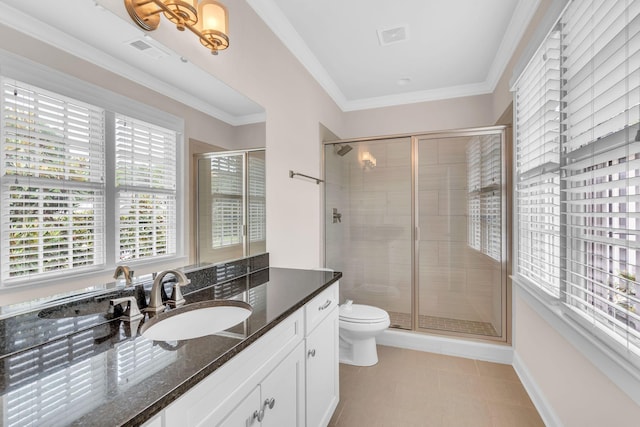 bathroom featuring a shower stall, vanity, visible vents, and ornamental molding