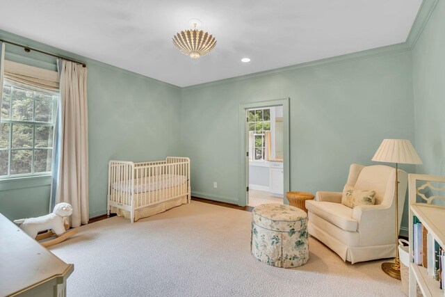 carpeted bedroom featuring baseboards, crown molding, and recessed lighting