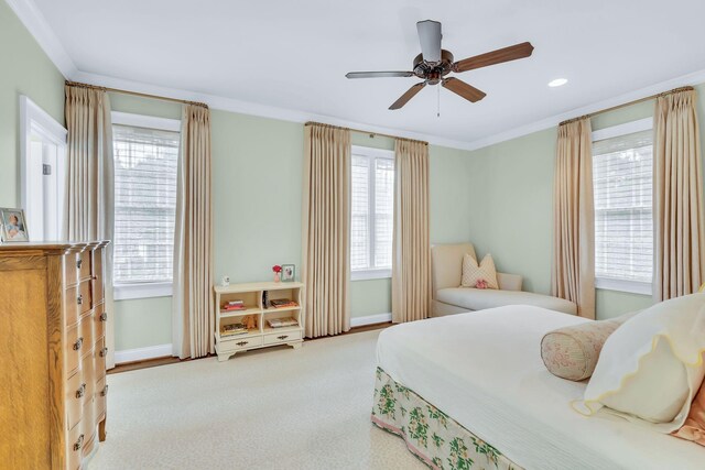 bedroom featuring ornamental molding, carpet flooring, ceiling fan, and baseboards