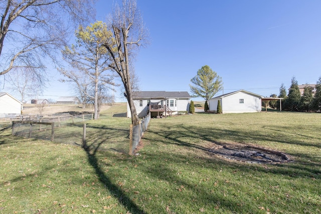 view of yard with fence and a wooden deck