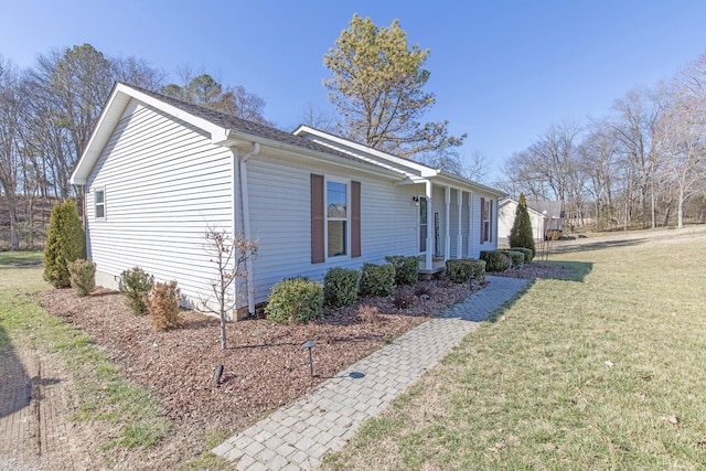 view of home's exterior featuring a lawn