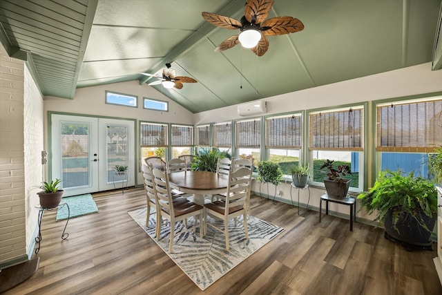 sunroom / solarium with a wall unit AC, vaulted ceiling with beams, ceiling fan, and french doors