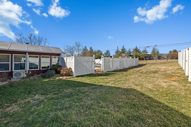 view of yard with ac unit and fence