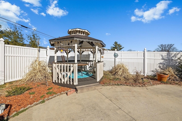 view of patio featuring a fenced backyard and a gazebo