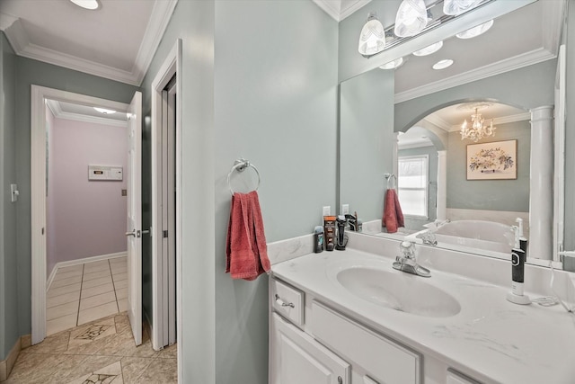 bathroom featuring baseboards, tile patterned flooring, vanity, and crown molding