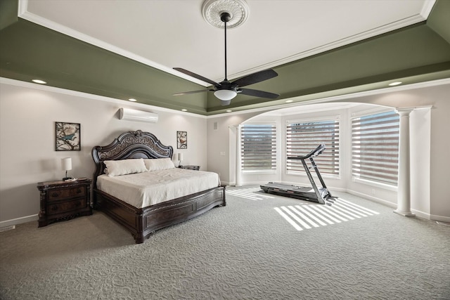 bedroom with baseboards, a wall unit AC, carpet flooring, and ornate columns