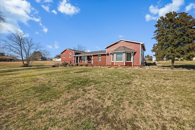 ranch-style house featuring a front yard