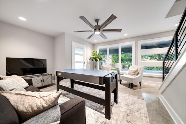 living room with ceiling fan, baseboards, and recessed lighting