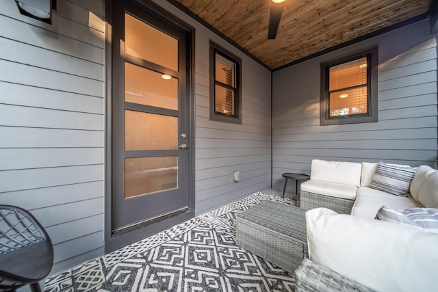 entrance to property featuring covered porch and an outdoor hangout area