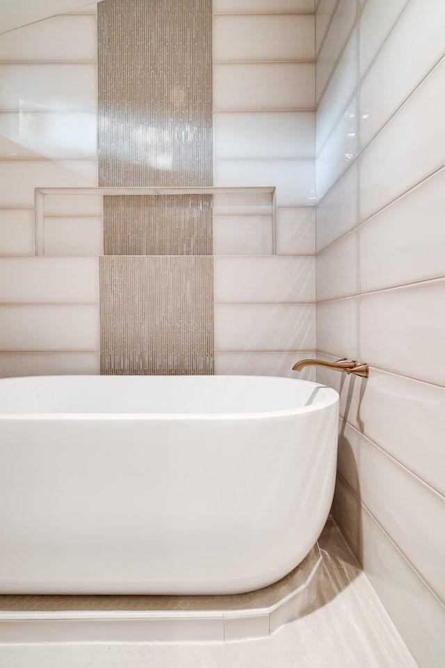 full bath featuring a freestanding bath