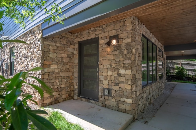 view of exterior entry with stone siding