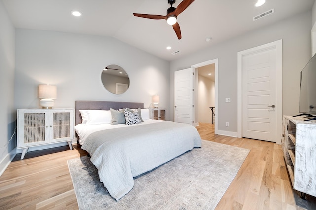 bedroom with recessed lighting, visible vents, light wood-style floors, a ceiling fan, and vaulted ceiling