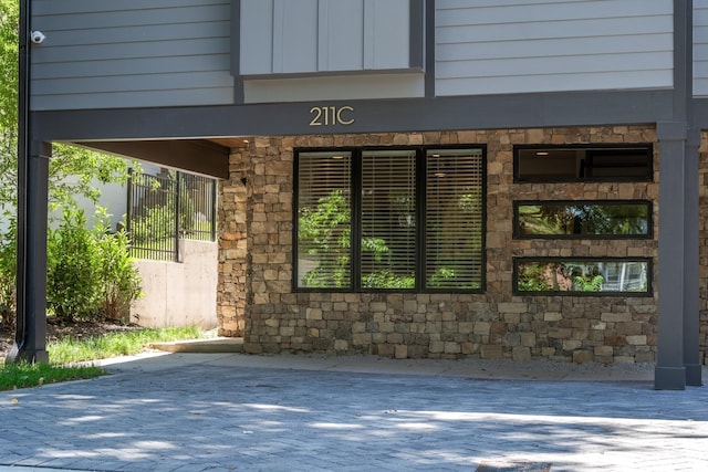 exterior space featuring stone siding