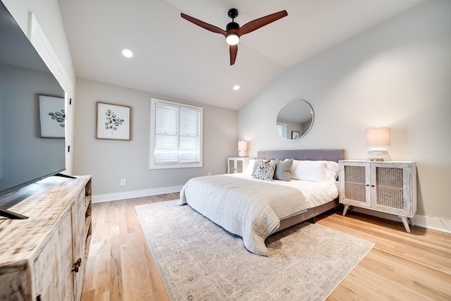 bedroom with lofted ceiling, recessed lighting, baseboards, and light wood-style floors