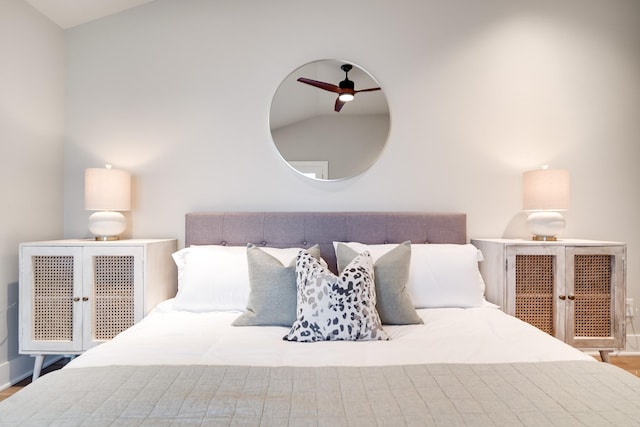 bedroom with lofted ceiling and a ceiling fan