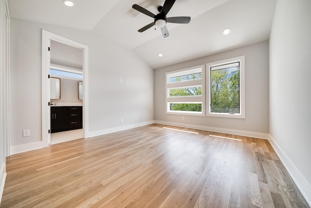 unfurnished bedroom with vaulted ceiling, light wood-type flooring, and recessed lighting