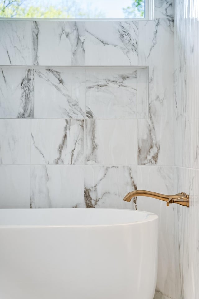 full bathroom with a soaking tub