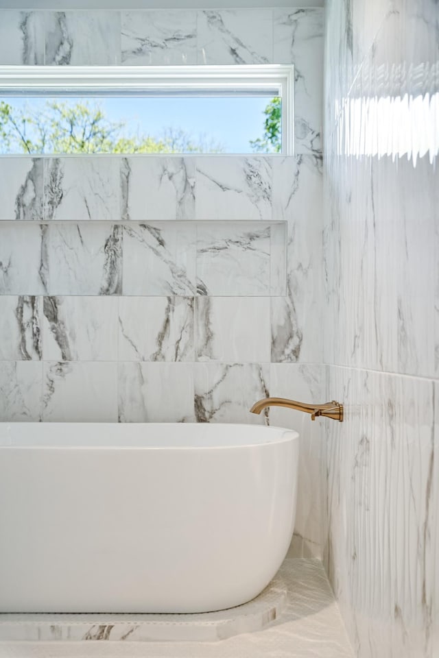 bathroom featuring a freestanding bath