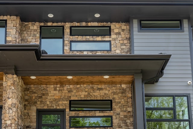 exterior space featuring stone siding