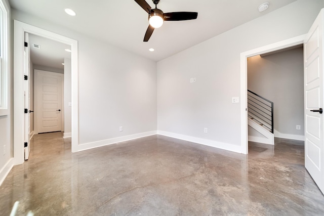 unfurnished bedroom featuring recessed lighting, concrete floors, baseboards, and ceiling fan