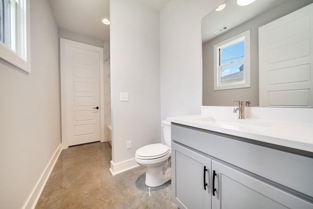 full bath featuring toilet, vanity, baseboards, visible vents, and finished concrete floors