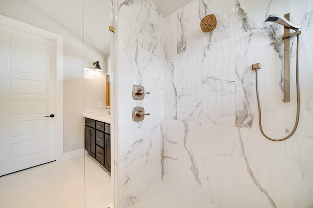 full bathroom with vanity, a marble finish shower, and tile patterned floors