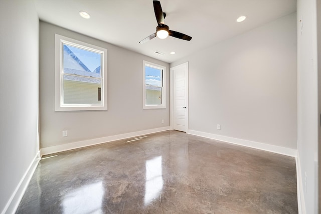 spare room with recessed lighting, visible vents, a ceiling fan, concrete floors, and baseboards