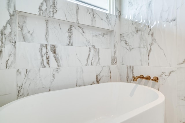 bathroom featuring a freestanding tub