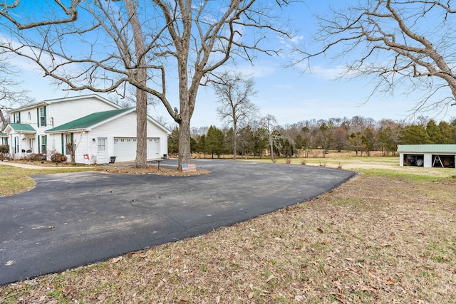 view of road with driveway