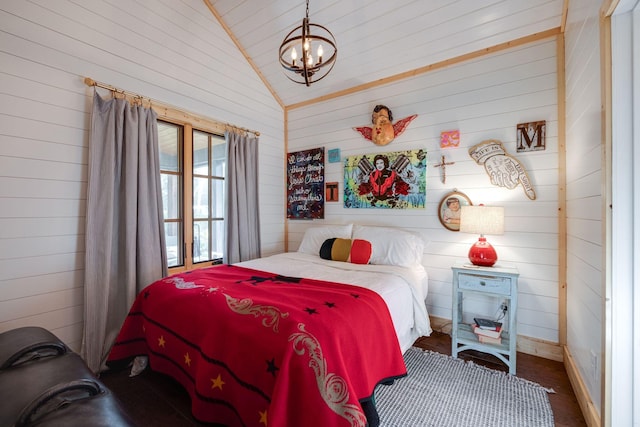 bedroom with a notable chandelier and vaulted ceiling