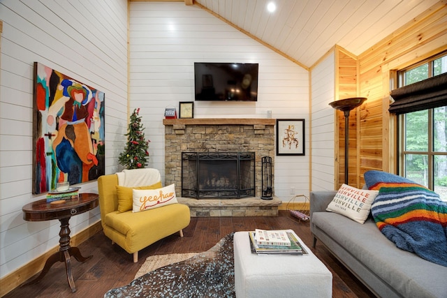 living room with lofted ceiling, wood-type flooring, a fireplace, and wooden walls