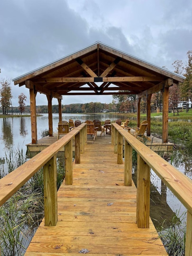 view of dock with a water view and a gazebo